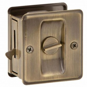 Ives SC991B609 Carded Privacy Sliding Door Lock - Antique Brass